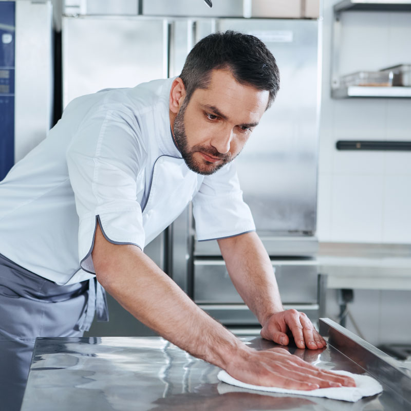 Man cleaning countertop