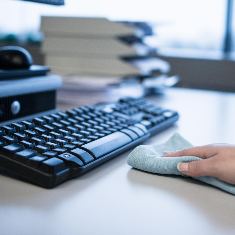 Keyboard being cleaned with a microfibre cloth