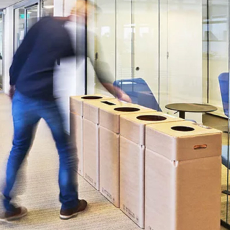 a person discards waste at a waste sorting station