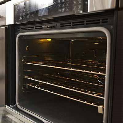 Cleaning ovens and steamers