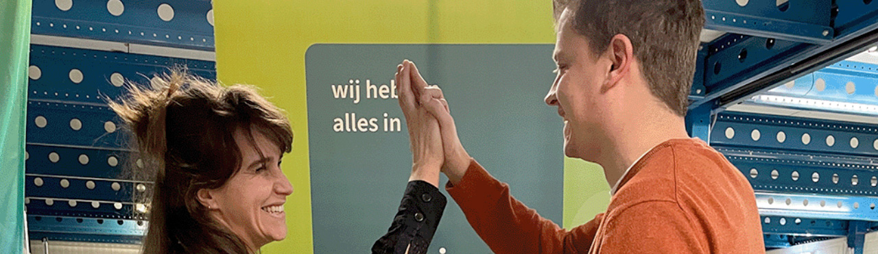 man and woman giving each other a high five